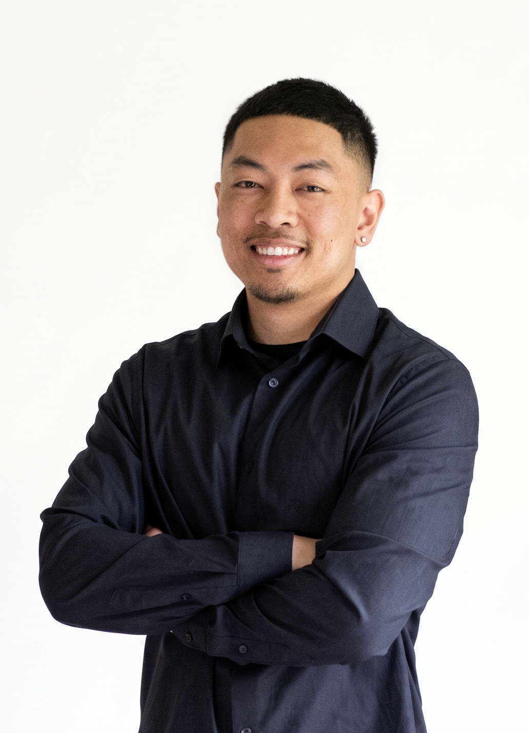 Jon Souriya in a navy shirt